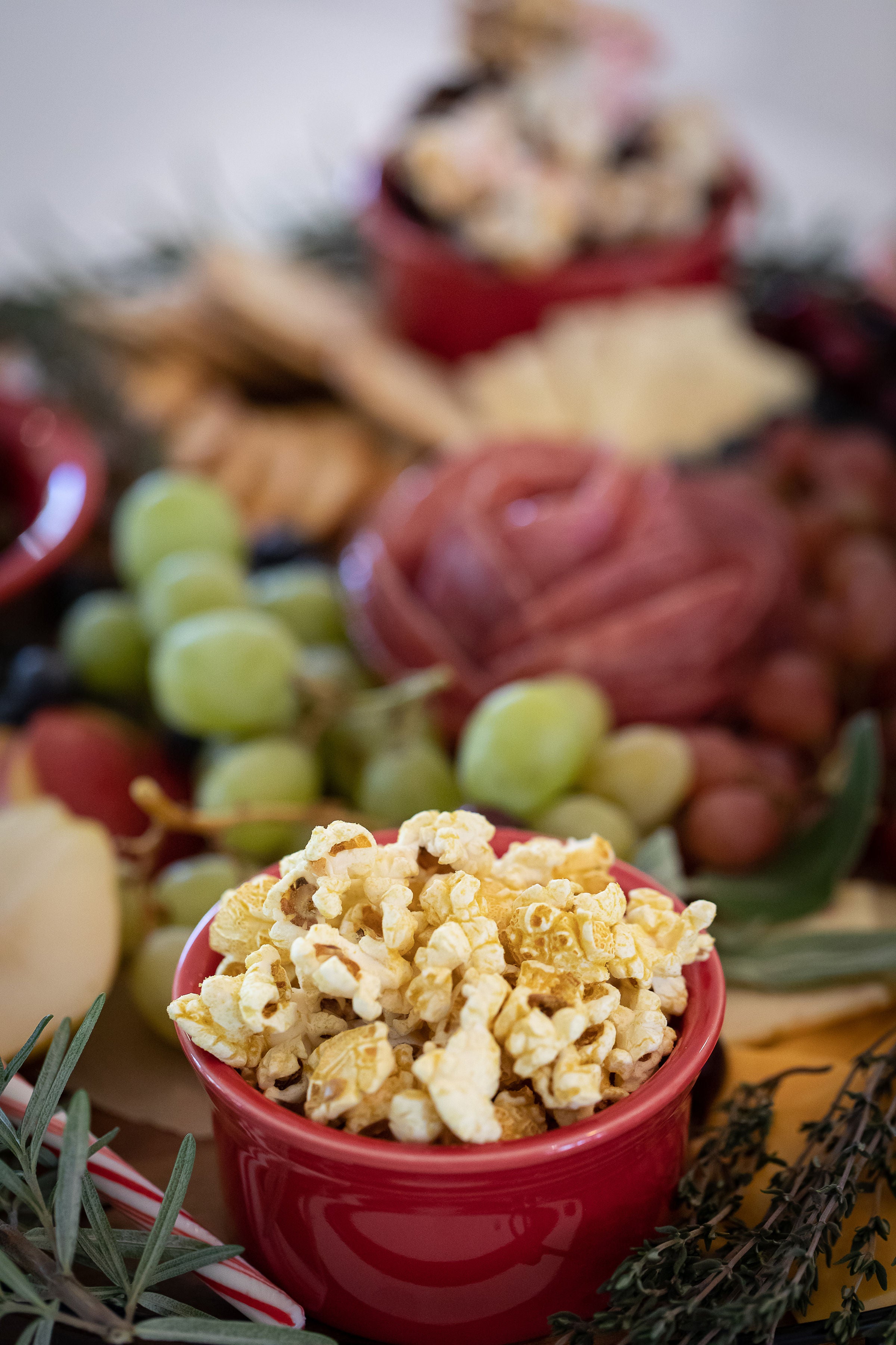 Gourmet Popcorn pictured on a fresh charcuterie board.